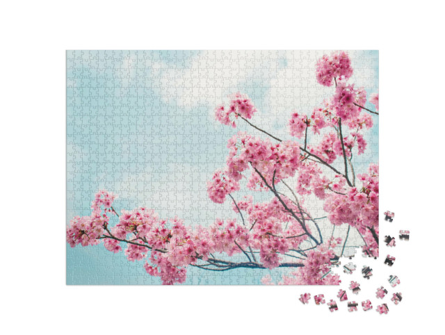 Puzzle de 1000 pièces « De charmantes branches de cerisier en fleurs sous un ciel bleu »