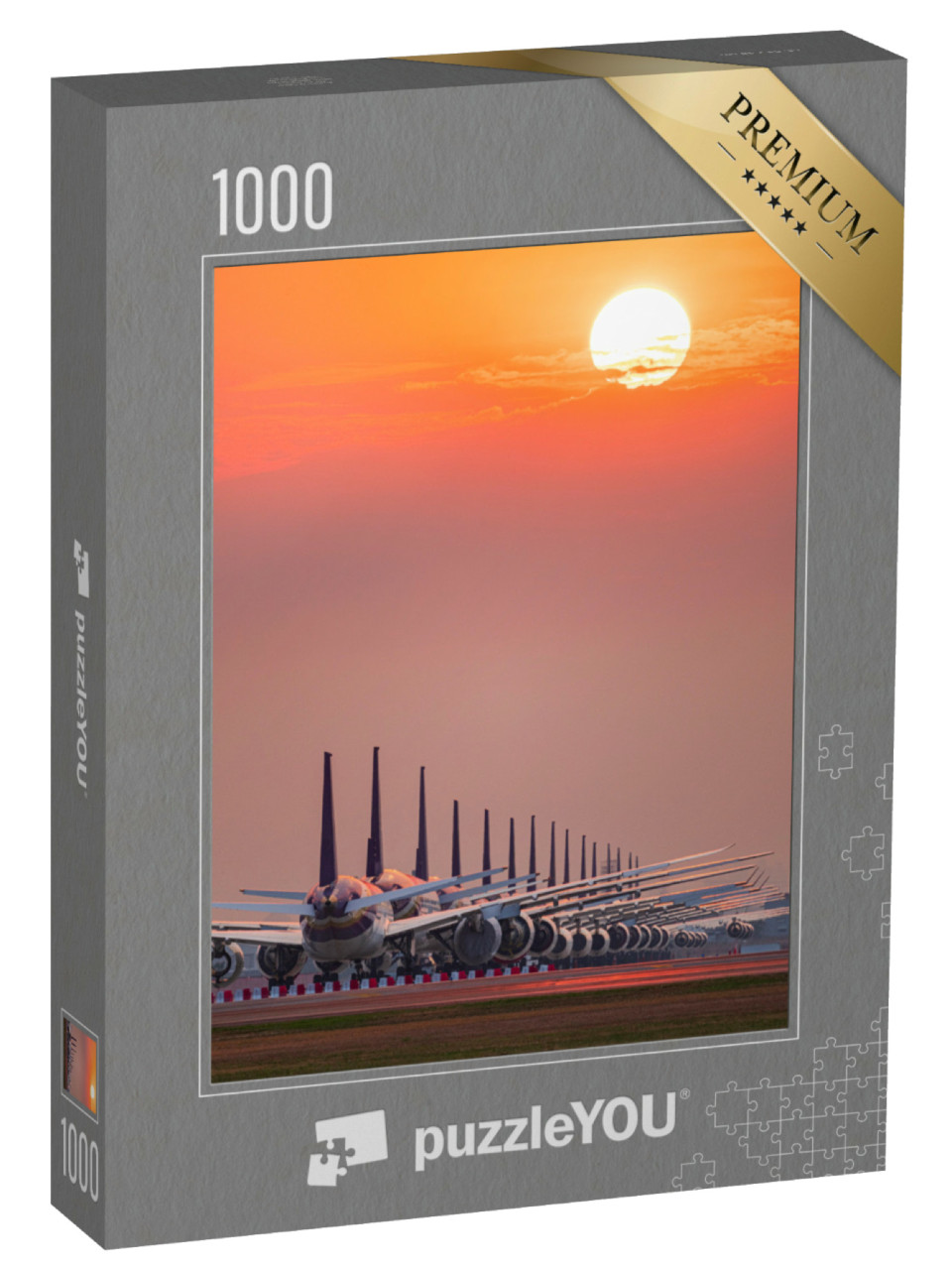 Puzzle de 1000 pièces « Des avions parfaitement garés au coucher du soleil »