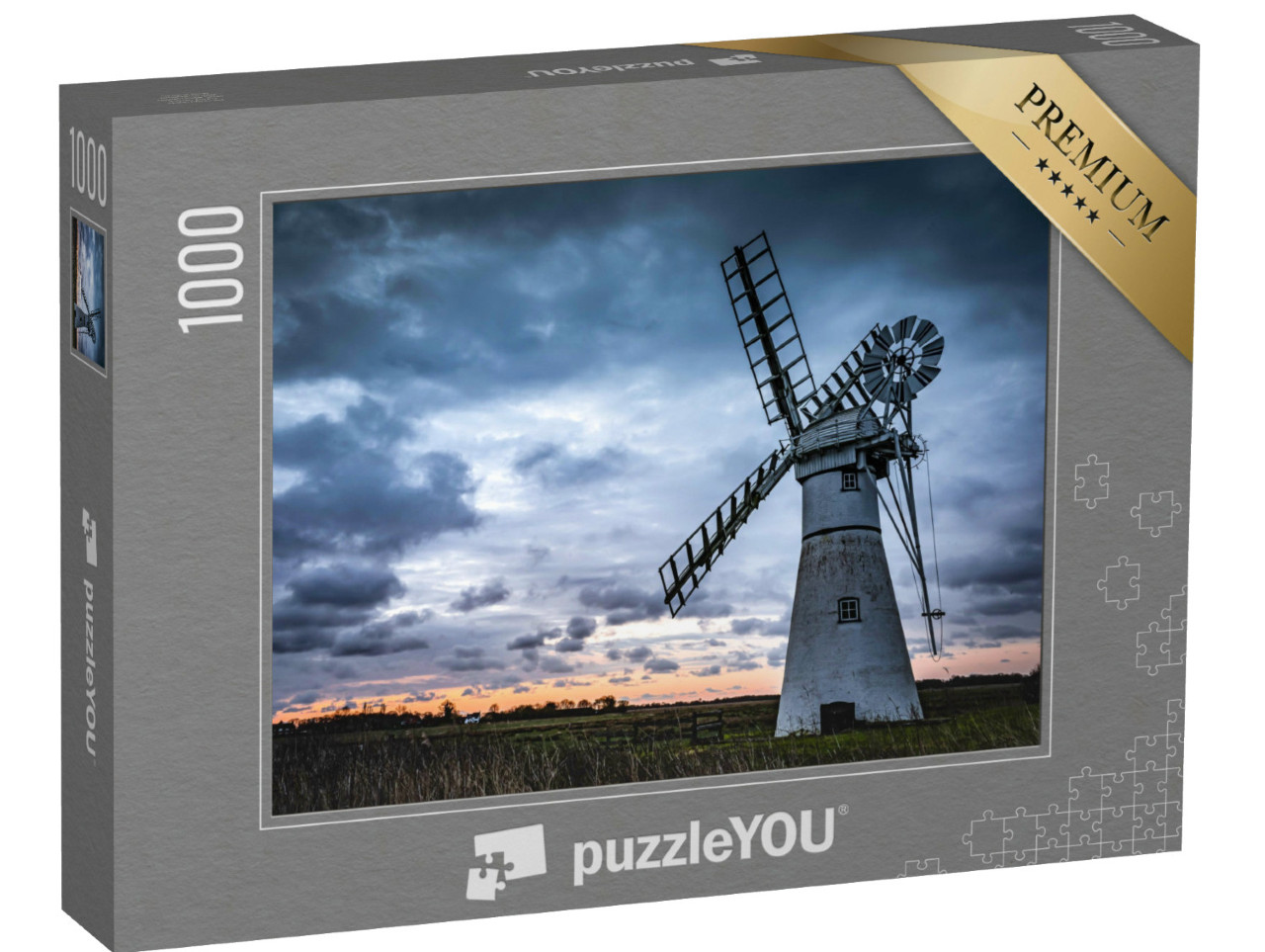 Puzzle de 1000 pièces « Un moulin dans un champ avec un coucher de soleil »