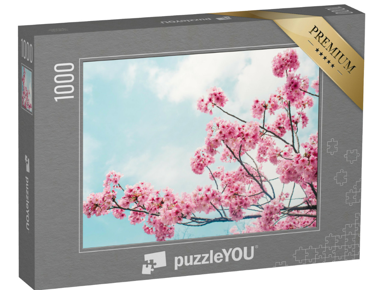 Puzzle de 1000 pièces « De charmantes branches de cerisier en fleurs sous un ciel bleu »