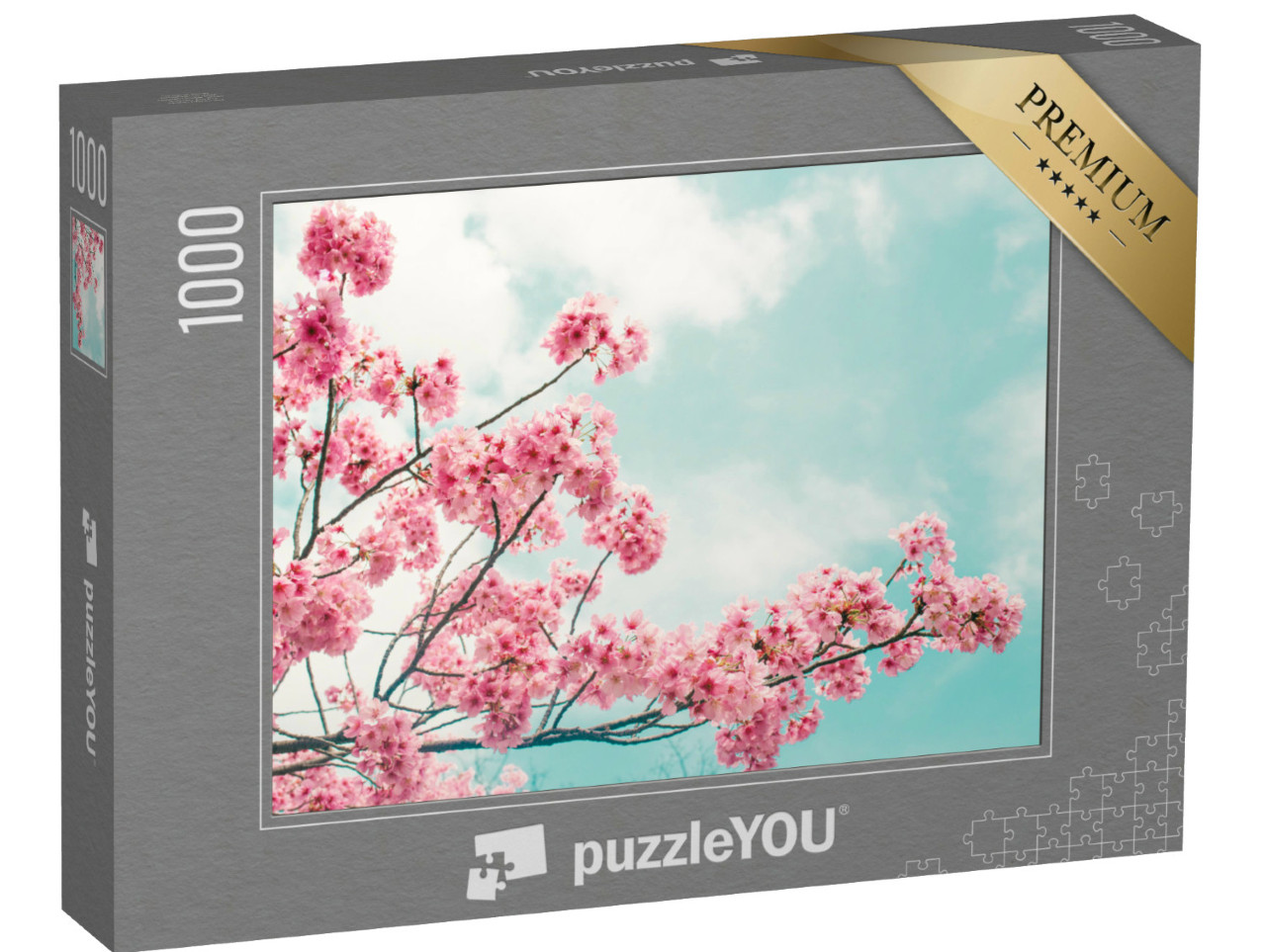 Puzzle de 1000 pièces « Magnifique branche de cerisier en fleurs sur fond de ciel bleu »